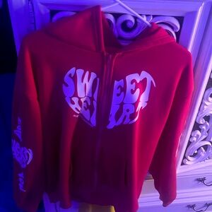 pink and white sweatshirt